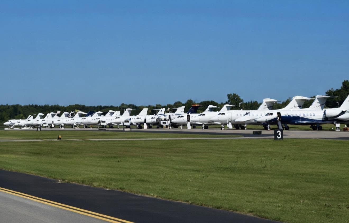 Image 4: A long row of private jets parked wingtip to wingtip on the ramp at Augusta Regional Airport, April 4, 2026.